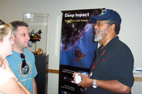 Ambassador James Butts talks with visitors at JPL's Open House (Click to enlarge)
